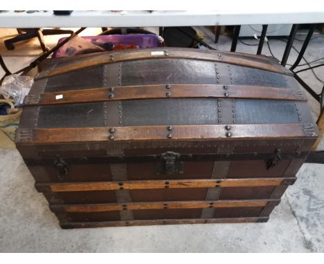 A LARGE HARD WOOD AND OAK BANDED DESIGN DOME TOP TRUNK 