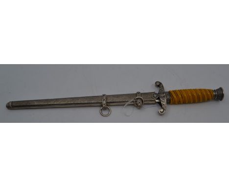 A REPRODUCTION Nazi officer's dagger, the 9.75" double-edged blade marked M&amp;H, with eagle-moulded guard, the hilt with 'e