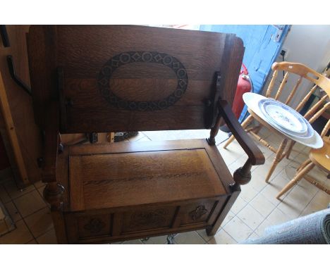 ***LOCATED AT GRESLEY***Mid 20th Century light oak Monks seat which reverts to a table, lift up seat, to reveal storage, thre