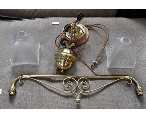 A late 19th or early 20th Century brass two branch gas library lamp, converted to electric, a late Victorian Gothic type wall