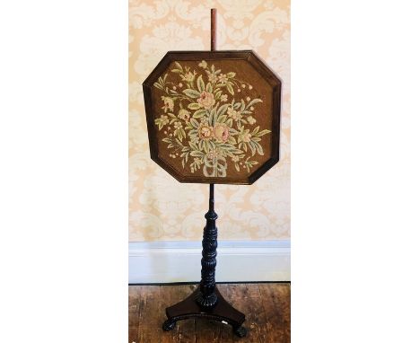 ***OBJECT LOCATION BISHTON HALL*** A Victorian mahogany pole screen, circa 1880, octagonal frame with tapestry inlay on a ree