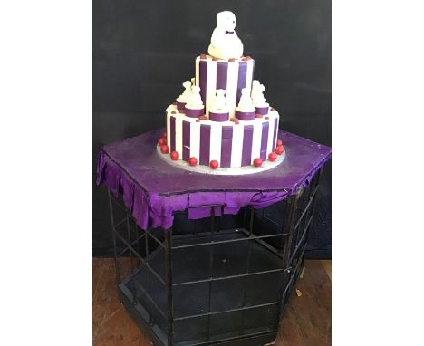 *** ITEM LOCATION BISHTON HALL*** Cake and Cage, used for the Baroness's Birthday party, along with presents.Provenance: From