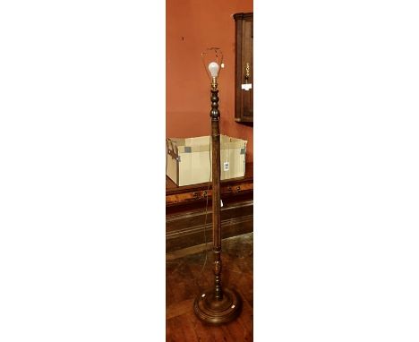 *** ITEM LOCATION BISHTON HALL** A 20th Century oak standing lamp with a fluted column; a 20th century print;&nbsp;A 20th Cen