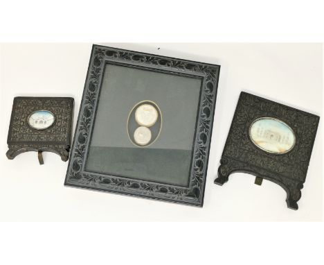 An Indian miniature of the Taj Mahal, carved ebony frame, 14 x 10.5 cm overall; a similar miniature; another item 
