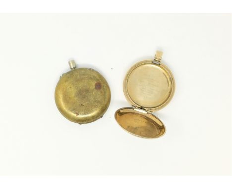 An early 20th century pocket watch case, in engine turned gold plate; and another 