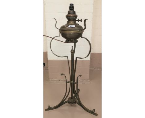 An Edwardian Art Nouveau table oil lamp of wrought brass construction, tripod base, 68cm (converted to electric light) 