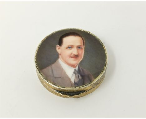A powder box depicting portrait of man in suit 