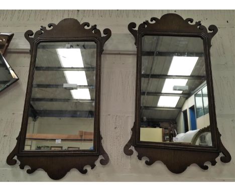 A pair of late 19th century Chippendale style wall  mirrors in oak fretwork frames 
