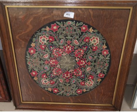 An embroidered circular panel with floral motifs, diameter 38 cm, framed; a circular embroidery of a gull 