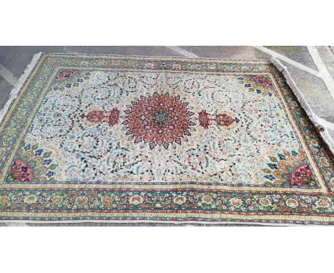 A modern finely hand knotted Persian carpet in the Kashan style, cream ground with multiple border and central medallion, all