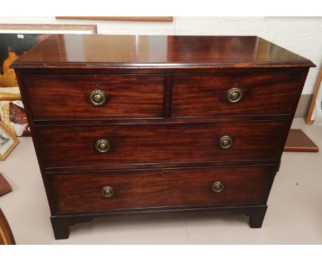 A 19th century mahogany chest of 2 long and 2 short drawers with brass ring handles, on bracket feet, width 101 cm 