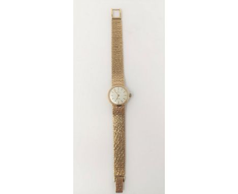 A ladies Omega Eterna-matic wristwatch in 9 carat with integral bark effect mesh strap, 31.3 gm gross 