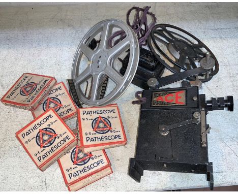 A Pathescope 9.5 mm projector (collectors item only) and 8 film shorts to include Mickey Mouse; a bed tray; other collectable