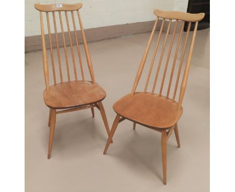 A pair of Ercol high stick back dining chairs in light wood 