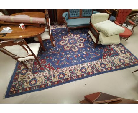 An early 20th century Indian carpet square with Persian design on blue ground 