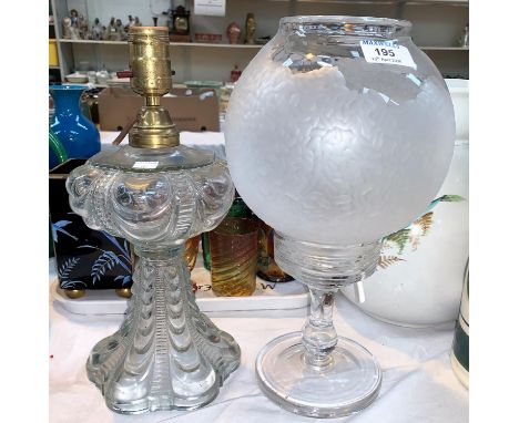 A clear glass table lamp with globular shade, engraved pattern, 34 cm and a moulded glass table lamp 