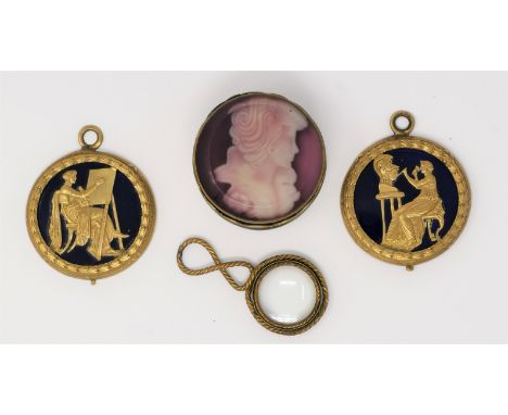 A pair of gilt brass plaques depicting sculpture and painting, blue enamel ground, diameter 50 mm; a magnifying glass; a deco