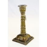 An Art Nouveau treacle glaze Burmantofts candlestick with Devil head decoration