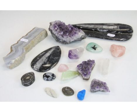 A collection of various rocks and crystals to include amethyst and rose quartz.