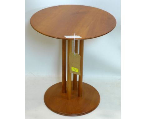 A contemporary circular cherry wood lamp table, raised on four cylindrical supports, H.51 D.45cm 