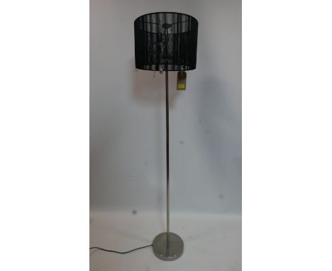 A contemporary standard lamp with shade 