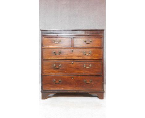 A Georgian mahogany and inlaid chest of two short over three long graduating drawers on bracket feet. H.104 W.94 D.53cm 