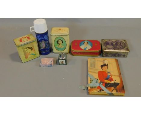 A collection of royal commemorative tins and other items including, thermos, Cadburys chocolate box, two commemorative pins o