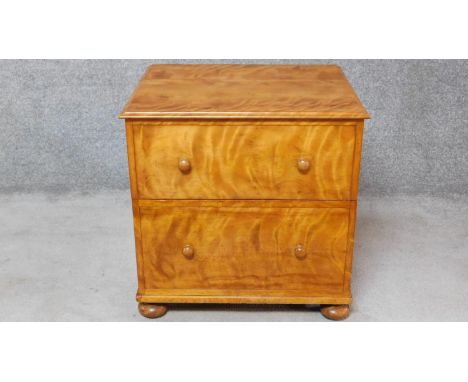 A mid 19th century satin birch commode. H.68 W.66 D.56cm 