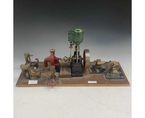 Model Steam engine. Comprising a hand built stationary steam engine with additional equipment mounted on a wooden board, toge