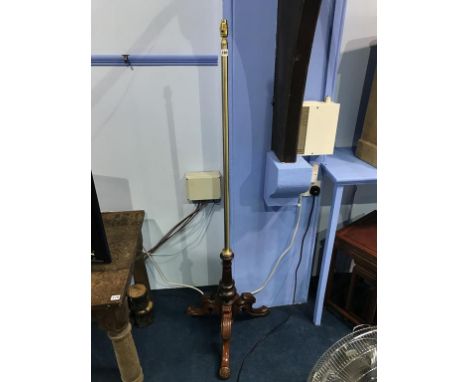 A mahogany and brass standard lamp