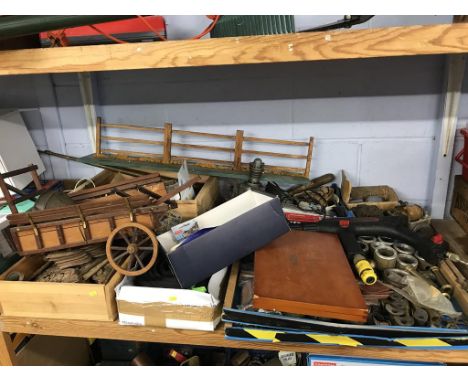 A shelf of model steam engine parts etc.