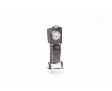 EARLY 20TH CENTURY MINIATURE SILVER CASED NOVELTY LONGCASE CLOCK the enamel dial with Roman numerals and pierced blued steel 