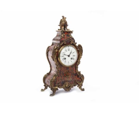 19TH CENTURY FRENCH RED BOULLE MANTEL CLOCKthe round white enamel dial with Roman numerals and blue steeled hands, the shaped