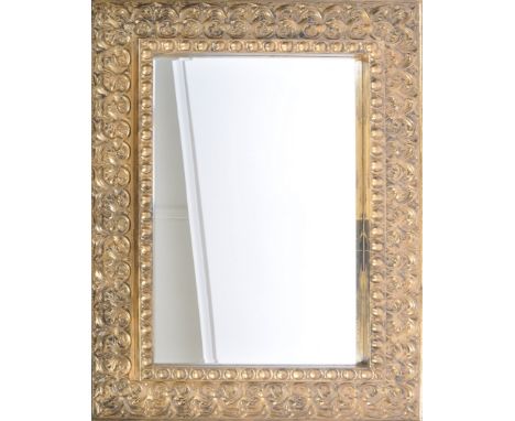 Gallery Home Decor - A large contemporary hanging mirror having a moulded foliate wood frame with a Roma Bronze effect finish