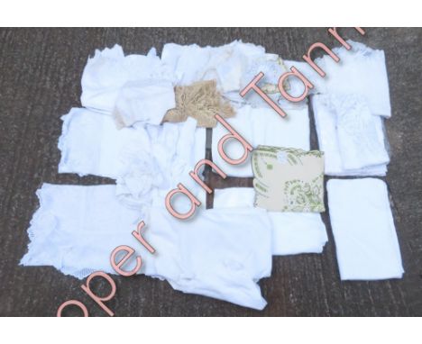 A large quantity of assorted vintage linens, to include tablecloths and napkins; machine and handmade lace