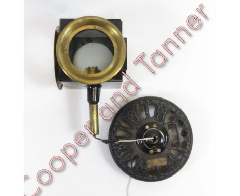 A vintage coaching lamp, on a later circular cast iron base