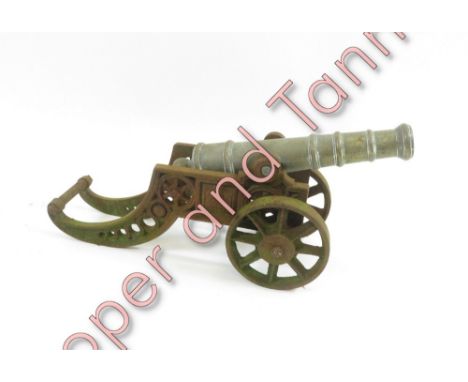 A military brass model of cannon, on an iron stand