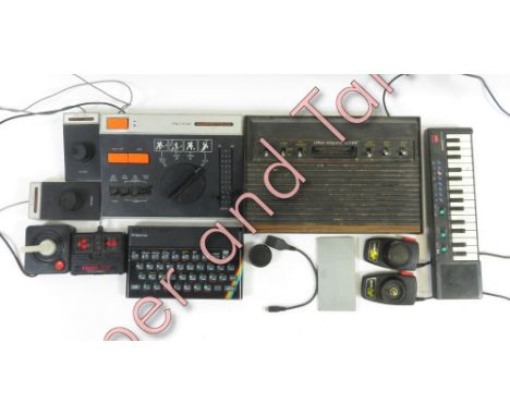 A collection of vintage video games and controllers including ZX Spectrum
