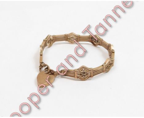 Bracelet, stamped '9C', of fancy six bar gate links, to a padlock clasp, 18 g gross