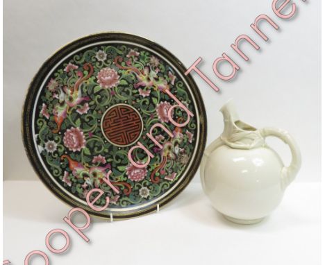 A Royal Worcester ball shaped jug, shaped 1341, in a white gloss glaze, 22cm high along with a Royal Worcester charger decora