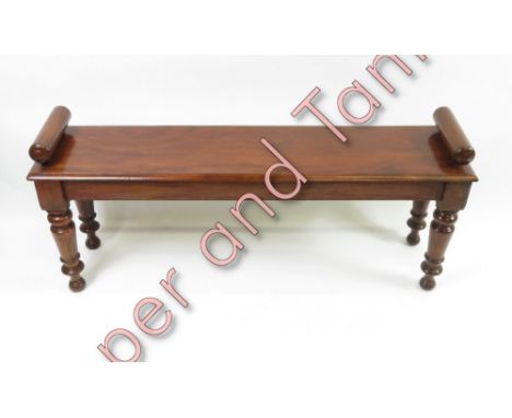 A long mahogany stool on four shaped legs, 122cm long, 30.5cm deep, 51cm high max