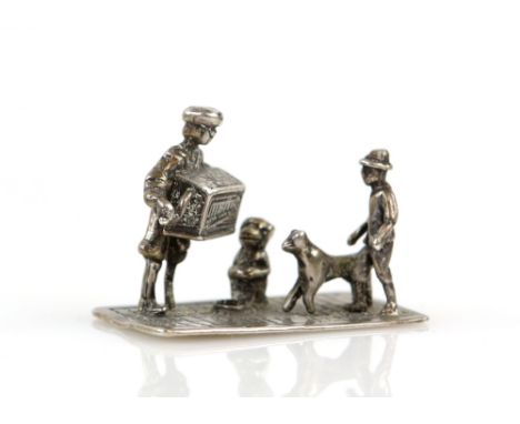 Miniature Dutch silver street scene of an accordion player with monkey and man watching with his dog .    