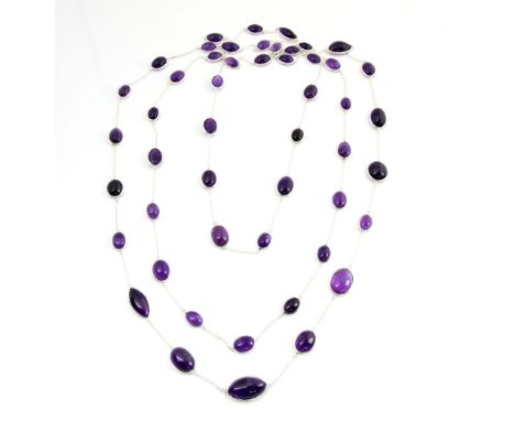 Long contemporary amethyst set necklace, the large oval stones cabochon cut, mounted on a belcher link chain, length 252 cm  