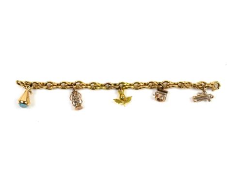 Vintage gold charm bracelet, with five charms, including miners lamp, thistle, wishing well, 19.2cm in length, all in 9 ctSol