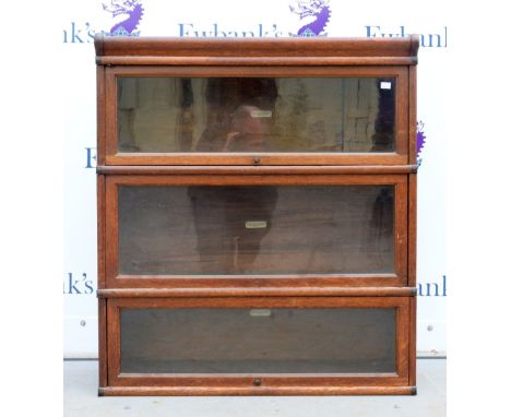 Early 20th century oak and glazed three-tier Globe Wernicke sectional bookcase..    