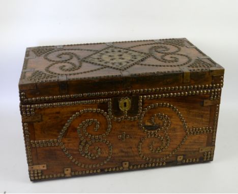 Mahogany studded trunk .    