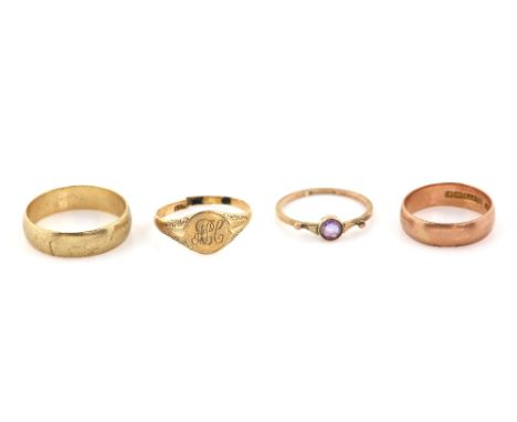 Four gold rings, one set with round cut amethyst, size N, another signet with monogram engraving, size O and two wedding band