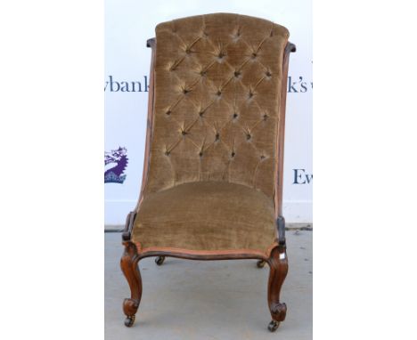 19th century mahogany framed button back nursing's chair .    