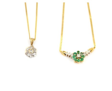 A diamond set floral pendant on chain in 9 ct, and another with emerald and diamond in 14 ct gold .    9 ct pendant gross wei