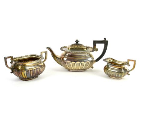 Silver three-piece tea service with fluted bodies, marks for Chester, gross weight 35 oz.(3) .    